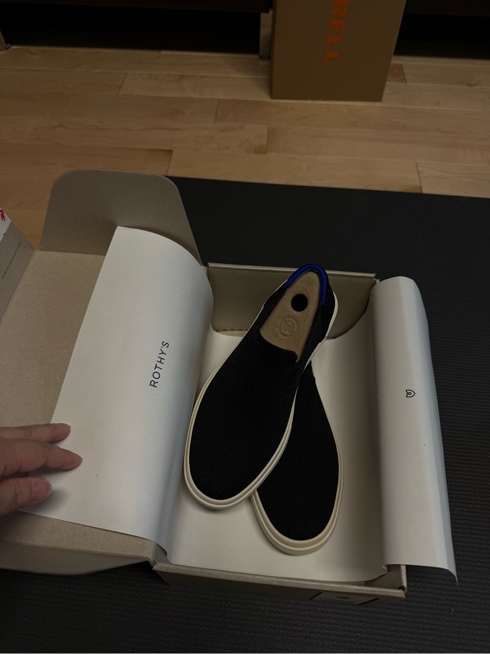 Rothy's Black Slip-On Loafers with Blue Trim